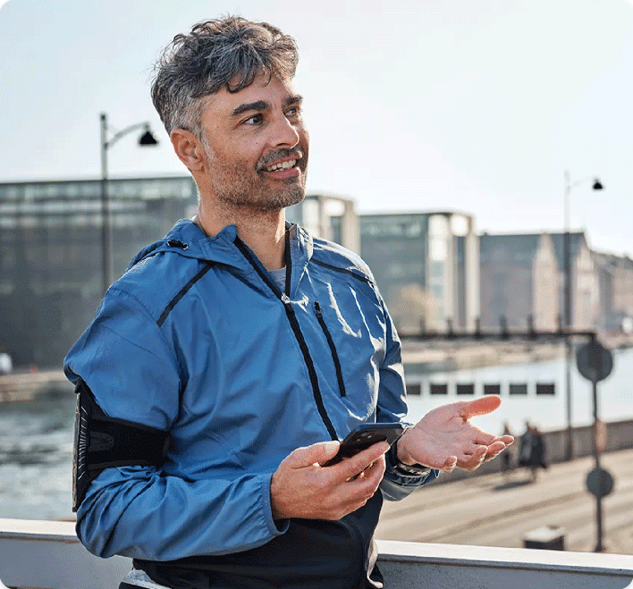 Man talking on his cell phone while going for a run