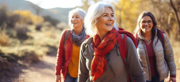 Mature friends outside getting exercise to help reduce stress and tinnitus